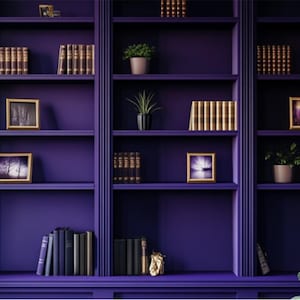 May include: A purple bookshelf with multiple shelves filled with books, framed pictures, and potted plants.