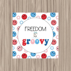 May include: A white background with a circle in the center that says "FREEDOM IS groovy" in colorful retro letters. The background is filled with a pattern of red, blue, and pink smiley faces and flowers.