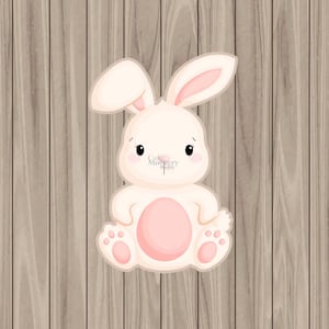 May include: A cute cartoon bunny with pink ears and a pink belly sitting on a wood background.