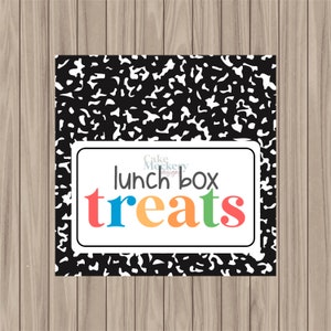 May include: Black and white notebook paper background with a white rectangle. The rectangle has a white border and the text "lunch box treats" in colorful letters. The letters are red, blue, orange, yellow, and green.