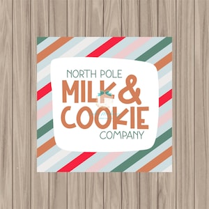 May include: A white square with rounded corners and a striped border in shades of blue, green, pink, and brown. The text "NORTH POLE MILK & COOKIE COMPANY" is printed in brown letters.
