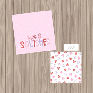 May include: Pink and white printable gift tag with the text "hugs & squishes" and a pink and white heart pattern on the back.
