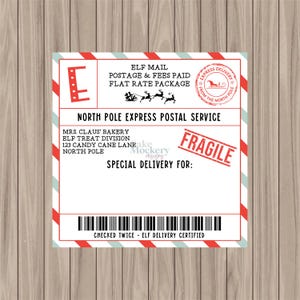 May include: A festive Christmas-themed label with red and white striped borders. The label reads "Elf Mail" and "North Pole Express Postal Service." It includes a "Fragile" stamp and space for a special delivery address. A barcode is at the bottom.
