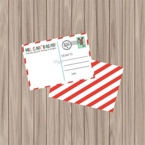 May include: A red and white striped postcard with the text "Mrs. Claus' Bakeshop" and "baking spreads, cookies & brownies". The postcard has a space for a message and a stamp with a cartoon image of Santa Claus.