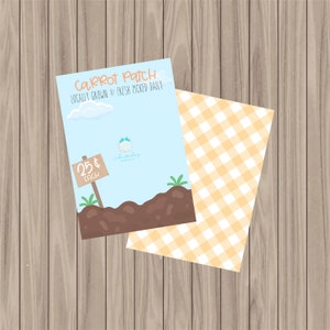 May include: A blue and white sign with the text "Carrot Patch Locally Grown & Fresh Picked Daily" and a price sign that says "25¢ Each". The sign is in front of a brown dirt mound with green grass.