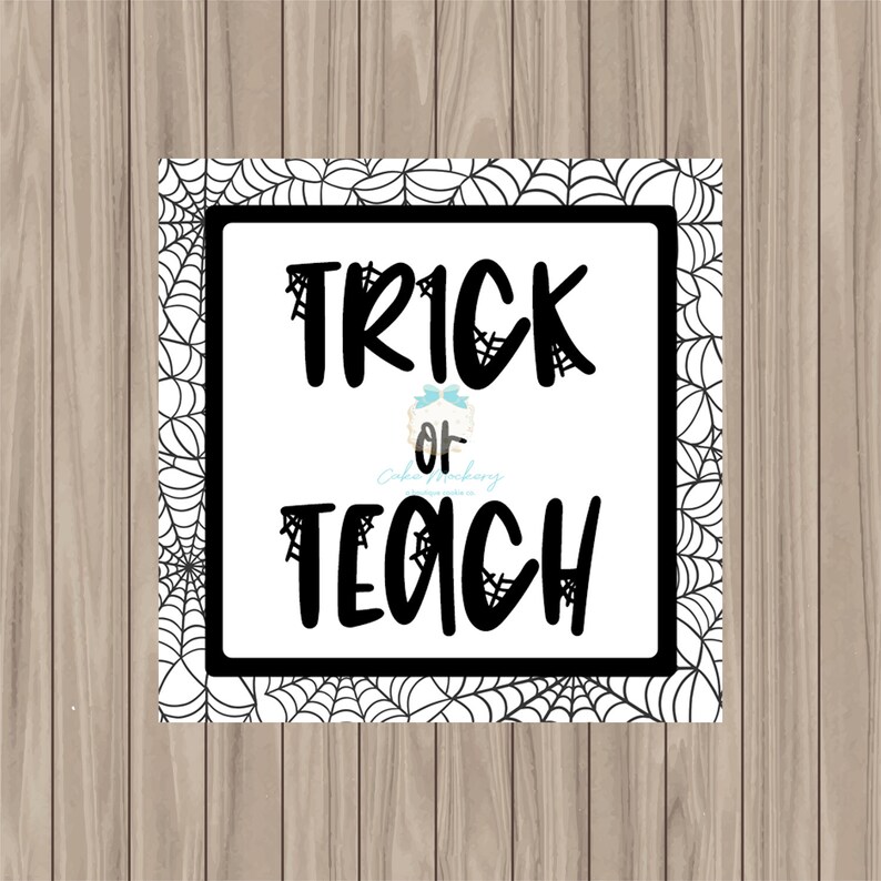 May include: A white sign with a black spiderweb border. The sign says "Trick or Teach" in black text.