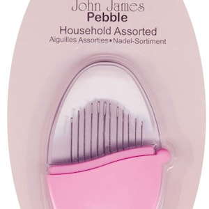 May include: A pink plastic container with a clear lid containing 12 assorted sewing needles. The container has the text "John James Pebble Household Assorted Aiguilles Assorties Nadel-Sortiment" printed on it.