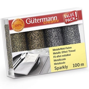 Puede incluir: Un paquete de tres carretes de hilo metálico Gütermann Sparkly. Los carretes son negro, dorado y plateado. El paquete dice "Value Pack" y "100 m".