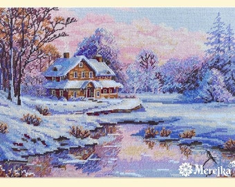 May include: A cross-stitch pattern of a winter scene with a small house in the foreground, a frozen lake, and trees covered in snow. The sky is a soft pink and blue.