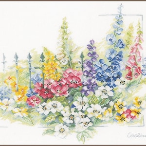 May include: A colourful cross-stitch pattern featuring a variety of flowers in shades of pink, purple, blue, yellow, and white. The flowers are arranged in a cluster and appear to be growing in a garden setting. The pattern is framed by a simple black fence.