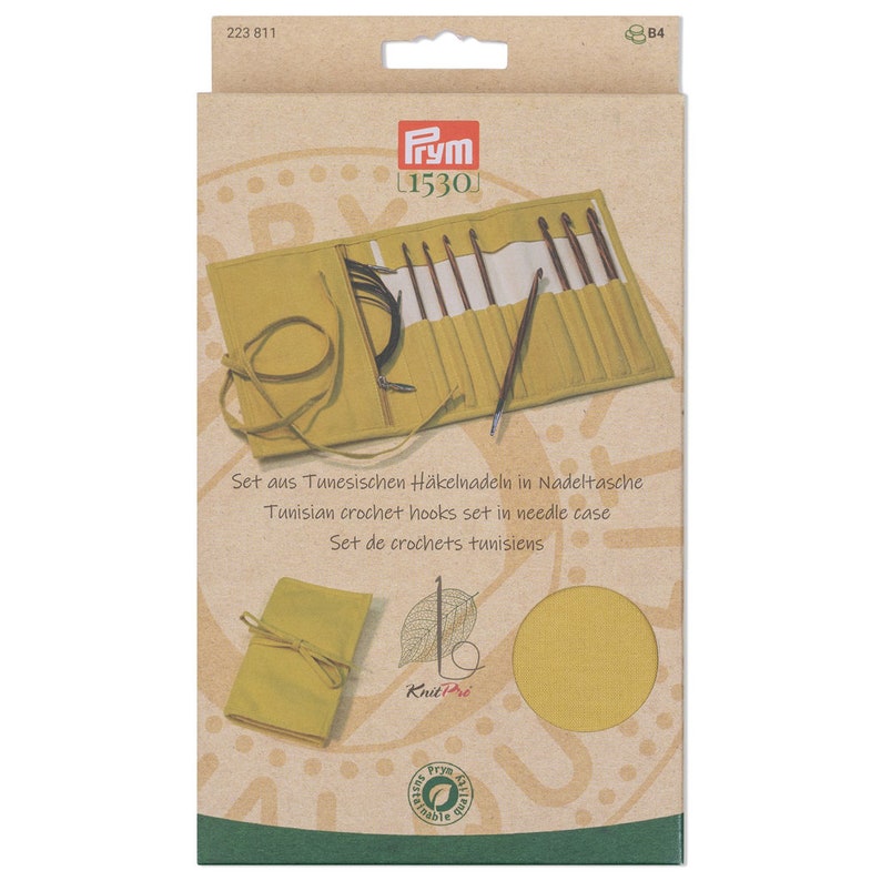 May include: A set of 10 Tunisian crochet hooks in a yellow canvas roll-up case. The case has a drawstring closure and the text "KnitPro" is printed on the front. The packaging is brown cardboard with the Prym logo and the text "Set aus Tunesischen H&auml;kelnadeln in Nadeltasche" in German.