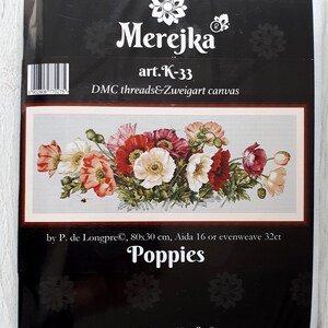 May include: Cross stitch kit featuring a colorful bouquet of poppies. The kit includes Aida canvas or evenweave, mouline threads, a needle, and a symbol pattern. The kit is by P. de Longpre and measures 80x30 cm.