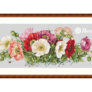 May include: A cross-stitch pattern featuring a bouquet of red, white, and pink poppies with green leaves and a bee. The pattern is framed in a brown wood frame and the text "Merejka" is in the upper right corner.