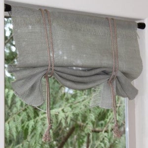Swag valance with rope ties and fringe. Swedish blind, adjustable rollup in Ivory White, Natural, Gray burlap. Custom made window treatment