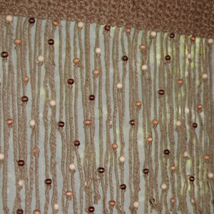 Natural, 100% jute crochet window valance 18&#39;&#39; tall with wooden beads. Widths 20&#39;&#39;, 22&#39;&#39;, 24&#39;&#39;, 26&#39;&#39;, 28&#39;&#39;, 30&#39;&#39;, 32&#39;&#39;, 34&#39;&#39;, 36&#39;&#39;