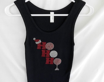 May include: Black tank top with a red and silver rhinestone design that says "HO HO HO" with a small silver charm that says "Merry Christmas".