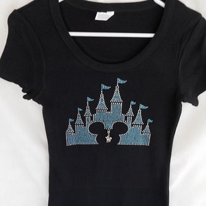 Disney Castle With Mickey Head Women's Rhinestone T-Shirt.  It Comes With A Removable Minnie Charm Or Choose A Charm From The 2nd Picture