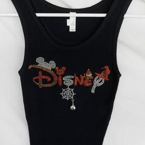 Disney Halloween Women's Rhinestone Tank Top.  It Comes With A Removable Pumpkin Charm Or Choose A Charm From the 2nd Pic.  Disney Shirts