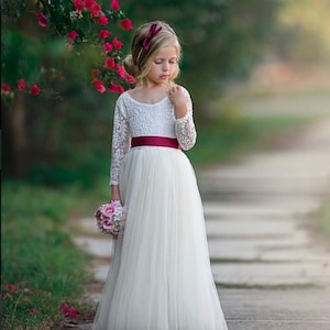 Elegant lace and tulle long sleeve flower girl dress for toddlers, girls, and junior bridesmaids, available in multiple colors for weddings and parties.