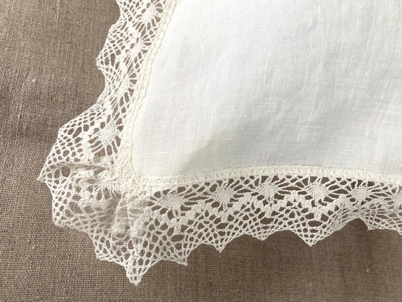 Ivory white linen pillow cover with a delicate crochet lace trim, euro sham with envelope closure. Custom size available.