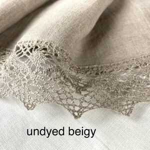 May include: Undyed beige linen fabric with a delicate crocheted lace trim. The fabric has a natural, rustic look and feel.