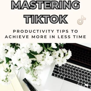 May include: A white laptop computer with a keyboard and trackpad is on a white surface. A bouquet of white flowers is in the upper left corner of the image. The text "Mastering TikTok Productivity Tips to Achieve More in Less Time" is at the top of the image. The text "Platt Digital Marketing" is at the bottom of the image.