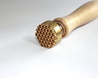 Stamp with a honeycomb pattern