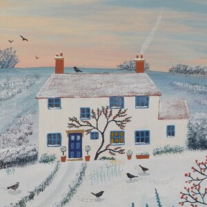May include: A white cottage with a blue door and snow-covered roof sits in a snowy landscape. A red-berried tree grows in front of the house. Several black birds are perched on the roof and flying in the sky.