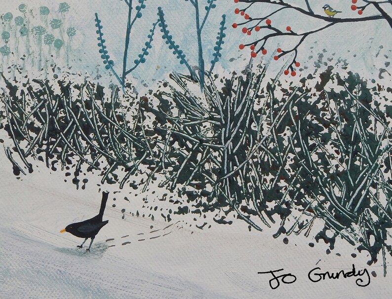 May include: A blackbird walks on a snowy path, leaving footprints behind it. The bird is walking towards a bush with green branches and red berries. The background is a light blue sky with a small blue bird perched on a branch.