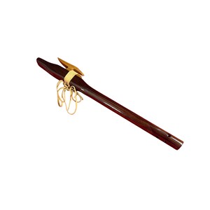 May include: A dark brown wooden flute with a polished finish, featuring a light-coloured wooden block attached to the top with tan leather lacing. The instrument has a long, cylindrical body with a visible mouthpiece and finger holes.