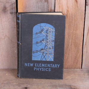 May include: A white ceramic mug with a black handle and the text "But First, Coffee" in a handwritten style. The mug is on a white surface. The mug is likely for hot beverages.