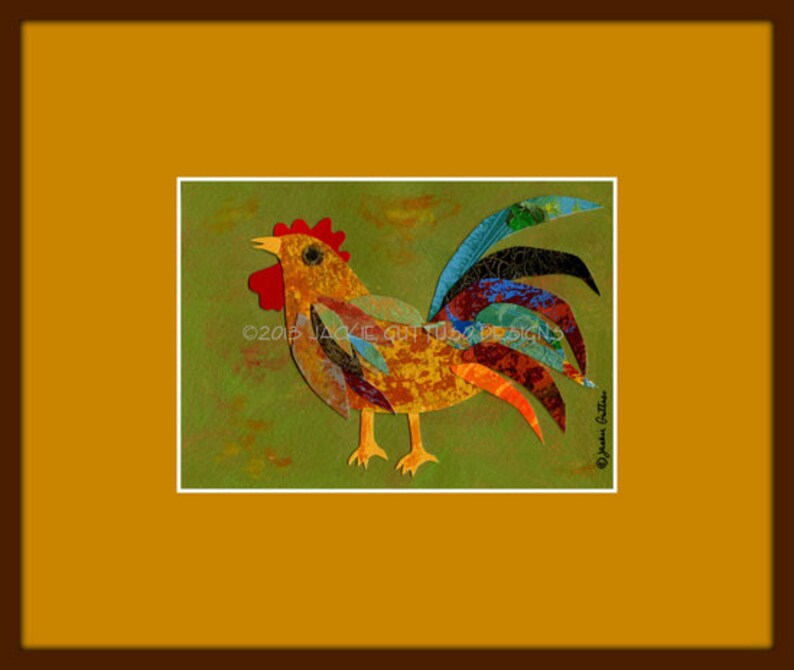 May include: A colorful rooster collage art print. The artwork features a rooster with a red comb and wattle, yellow beak and feet, and a multi-colored tail. The background is green with yellow and orange accents. The print is framed in white and set against a brown and gold background.