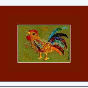 May include: A colorful rooster art print with a red comb and wattle, yellow beak, and a vibrant tail featuring blue, green, and black feathers. The artwork is set against a green background and framed in white, with a red border.