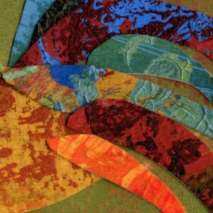 May include: Abstract artwork featuring layered, textured paper in various colors. The composition includes curved shapes in shades of orange, red, blue, and green, creating a dynamic and colorful design. The artwork has a handmade, artistic feel.