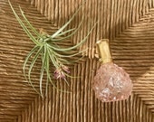 Vintage pink cut glass decorative perfume bottle.