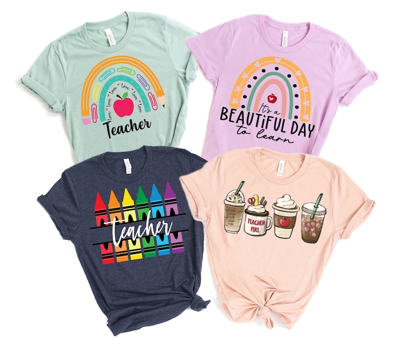 May include: Four different teacher t-shirts with various designs. The first shirt is light blue with a rainbow and the words "I love, I love, I love, Teacher". The second shirt is light purple with a rainbow and the words "It's a beautiful day to learn". The third shirt is navy blue with a row of colorful crayons and the word "Teacher". The fourth shirt is peach with four different coffee cups and the words "Teacher Fuel".