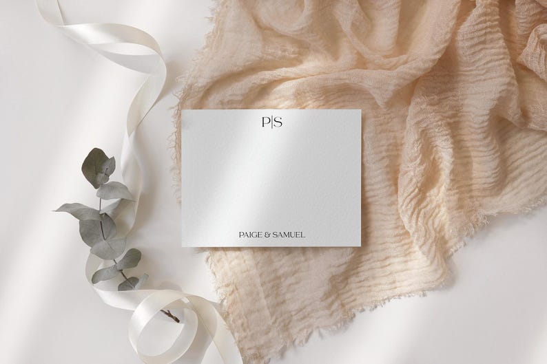May include: A white card with the initials "P.S." and the text "Paige & Samuel" printed in black.