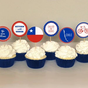 May include: Six cupcakes decorated with red, white, and blue frosting and toppers. The toppers feature a Chilean flag, a bicycle, and text that says "Go with Love", "Return with Honor", "Called to Serve", and "Chile".