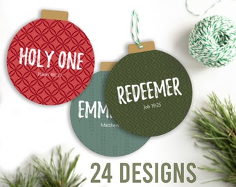 May include: Three Christmas baubles with different designs. The first bauble is red with a white circle pattern and the text "HOLY ONE" with the scripture reference "Isaiah 48:17". The second bauble is green with a white geometric pattern and the text "REDEEMER" with the scripture reference "Job 19:25". The third bauble is green with a white geometric pattern and the text "EMMANUEL" with the scripture reference "Matthew 1:23".