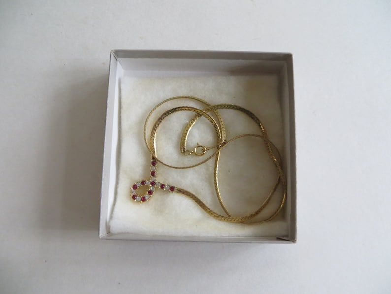 Avon Plaza Collection Red Simulated Ruby and Rhinestone Necklace Bracelet and Earrings In Original Boxes