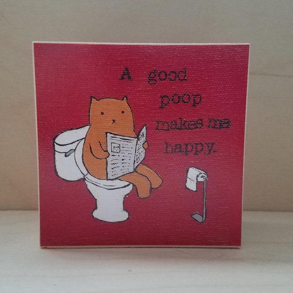 ART BLOCK: "A Good Poop Makes Me Happy" featuring a cat on a toilet reading the newspaper