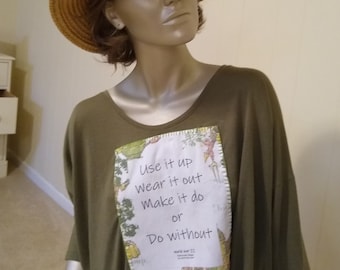 World War ll slogan suggesting thrift and frugality printed on vintage style cloth and stitched to an olive, loose fit t-shirt.