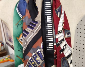 Four fabulous, vintage neckties,each with a musical motif from keyboards to harps.n