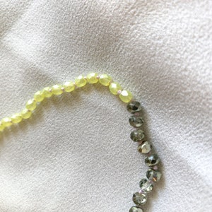 KNOTTED BEADED NECKLACE Yellow and metallic green crystal knotted beaded necklace with 14kt gold filled clasp zdjęcie 3