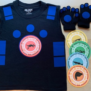 May include: A black sleeveless shirt with blue squares and circles, a red and orange circle with a kangaroo, and the text "GILDAN SIZE S" on the front. Five colorful round stickers with animal silhouettes on them.
