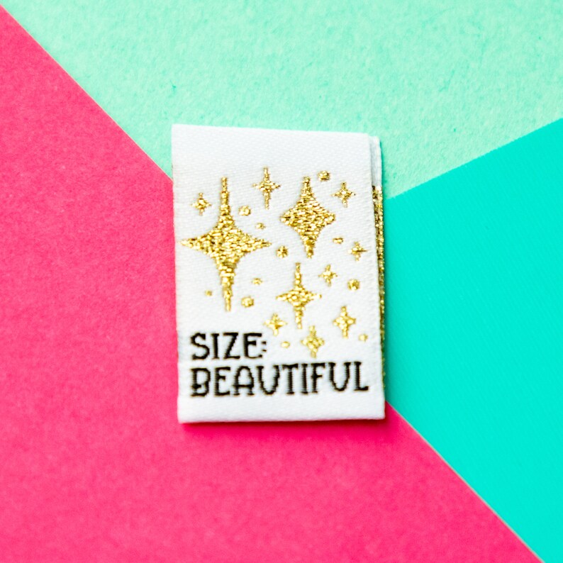 Size inclusive sew in labels for handmade or homemade items. Reads "Size: Beautiful" with gold stars on it.