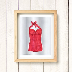 May include: A red and white gingham swimsuit with a bow at the neckline, on a blue and white striped background.