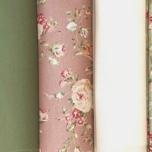 May include: Five fabric swatches with floral patterns. The swatches are in shades of cream, green, pink, white, and light green.