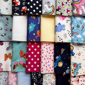 May include: A collection of 20 fabric squares featuring a variety of patterns, including foxes, dinosaurs, butterflies, stars, polka dots, and flamingos. The fabrics are in a range of colours, including blue, pink, yellow, green, and white.
