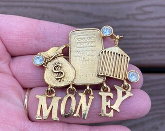 Signed and Faux Currency Rolls Royce Grill AJC Rich and Famous Matte and Shiny Goldtone Pin with Money Bag Rhinestones